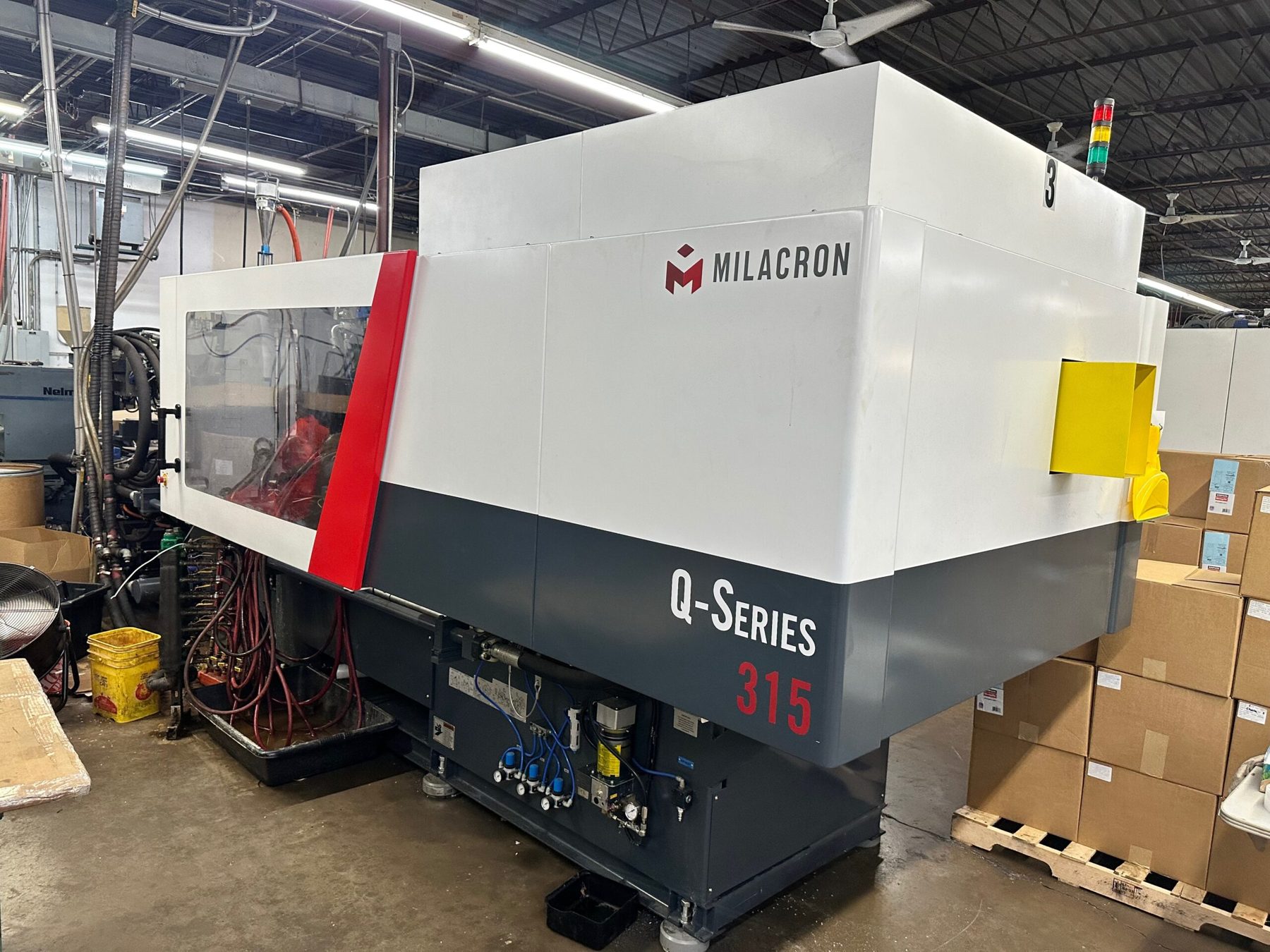 Milacron Q-Series 315 injection molding machine at Superior Plastics